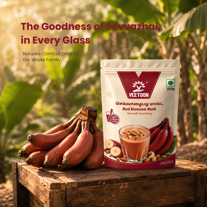 Veetoon Red Banana Malt pouch with fresh Sathyamangalam red bananas on a wooden crate